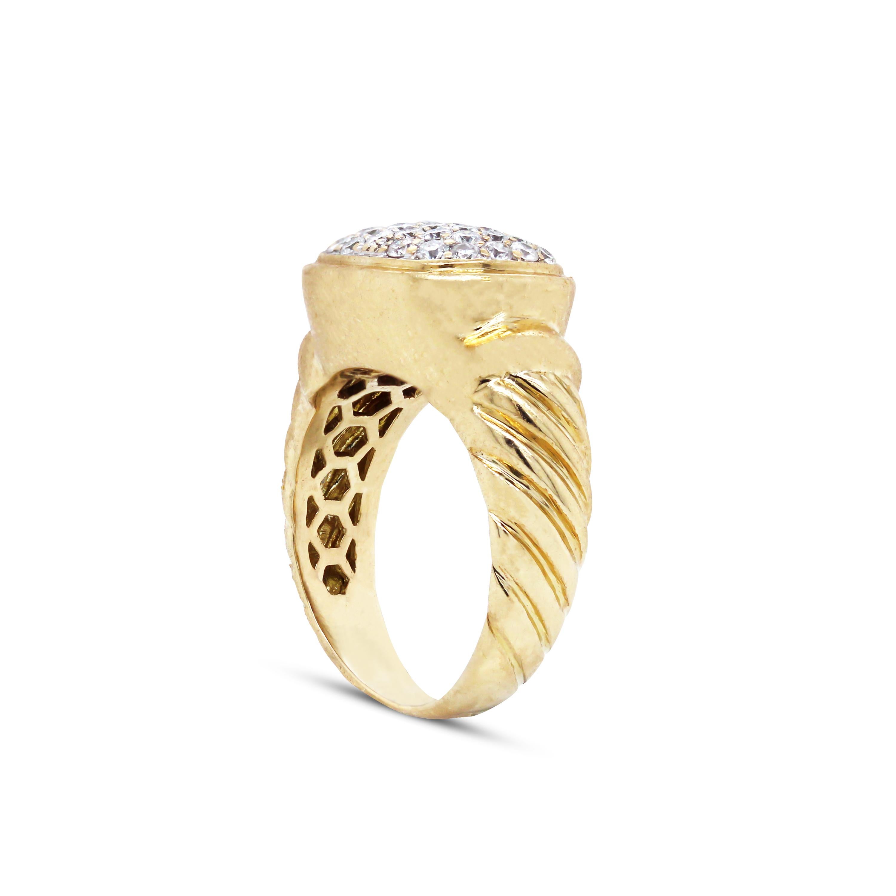 18K Yellow Gold and Diamond Cable Band Cocktail Ring

This ring features a unique cable band design on the band of the ring and pave set diamonds in the center

Apprx. 1 carat G color, VS clarity diamonds are set in the center of the ring

Ring face