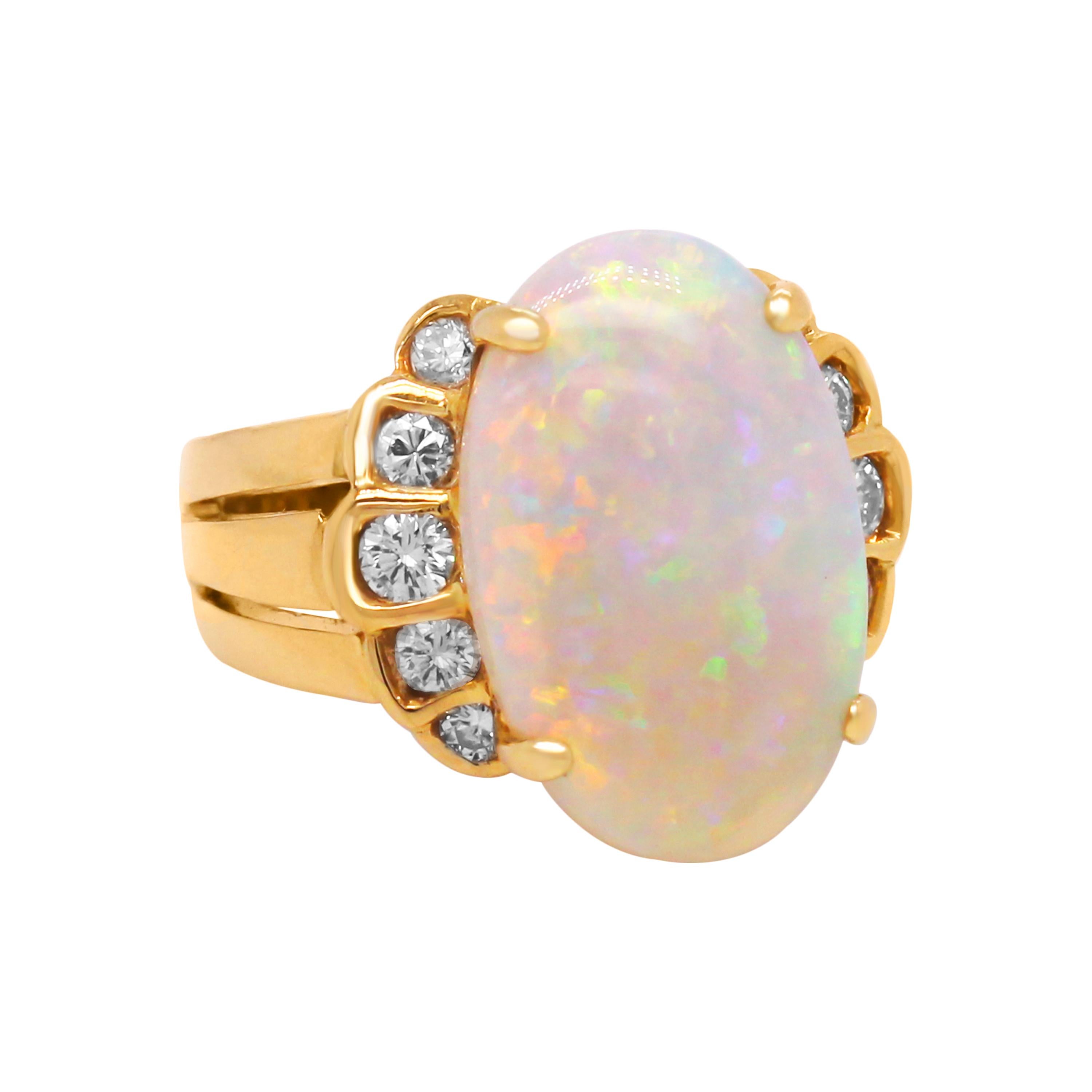 18k Yellow Gold and Diamond Cocktail Ring with Oval Ethiopian Opal Center

One-of-a-kind ring featuring an Opal center with incredible color and quality. 

0.40 carat G color, VS clarity diamonds

7.00 carat Opal center. Opal is an oval-cut and from