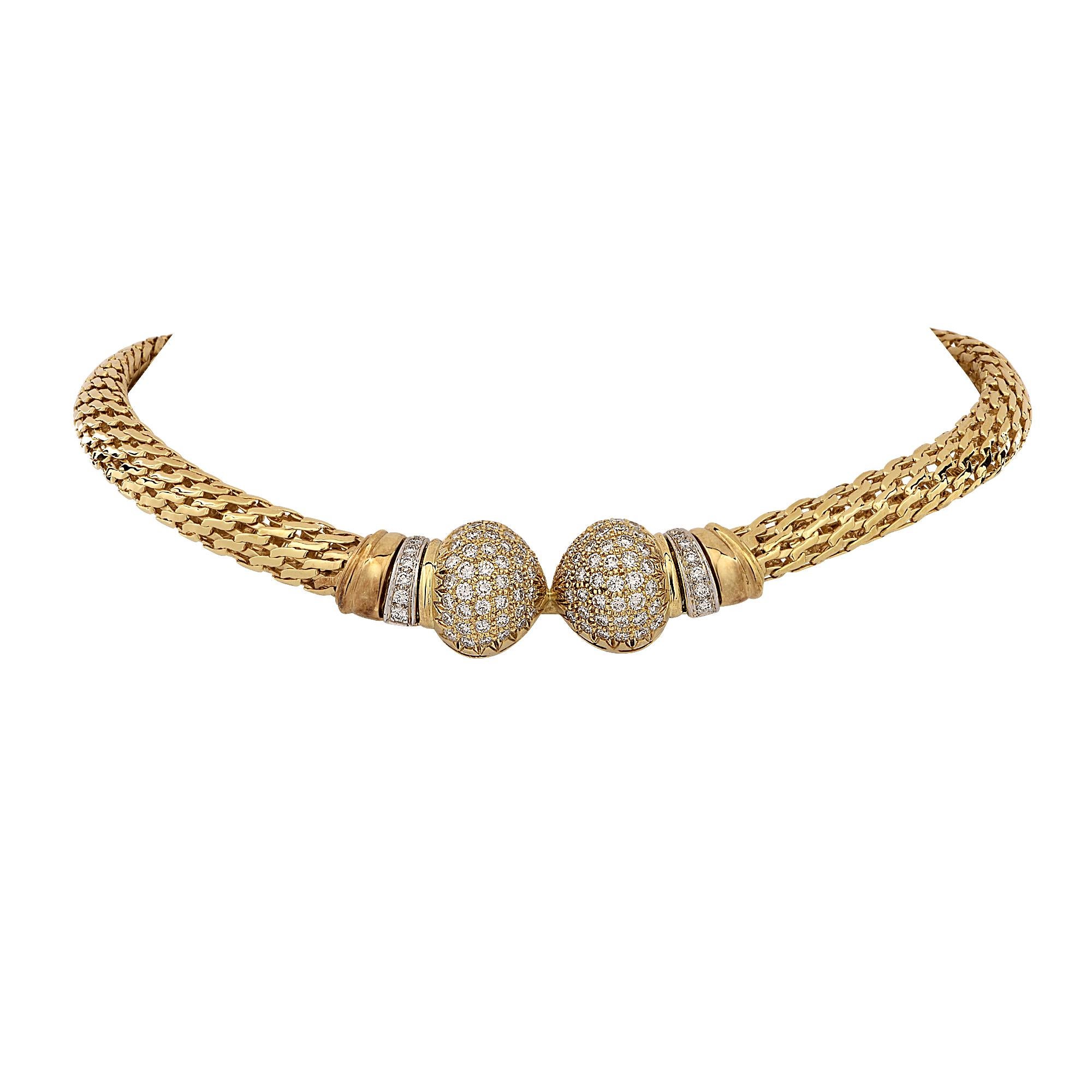 Striking necklace crafted in 18 karat yellow gold featuring 118 round brilliant cut diamonds weighing approximately 5.80cts G-H color and VS clarity. A woven 9.5 mm wide yellow gold chain snakes silkily around your neck and rests just below the