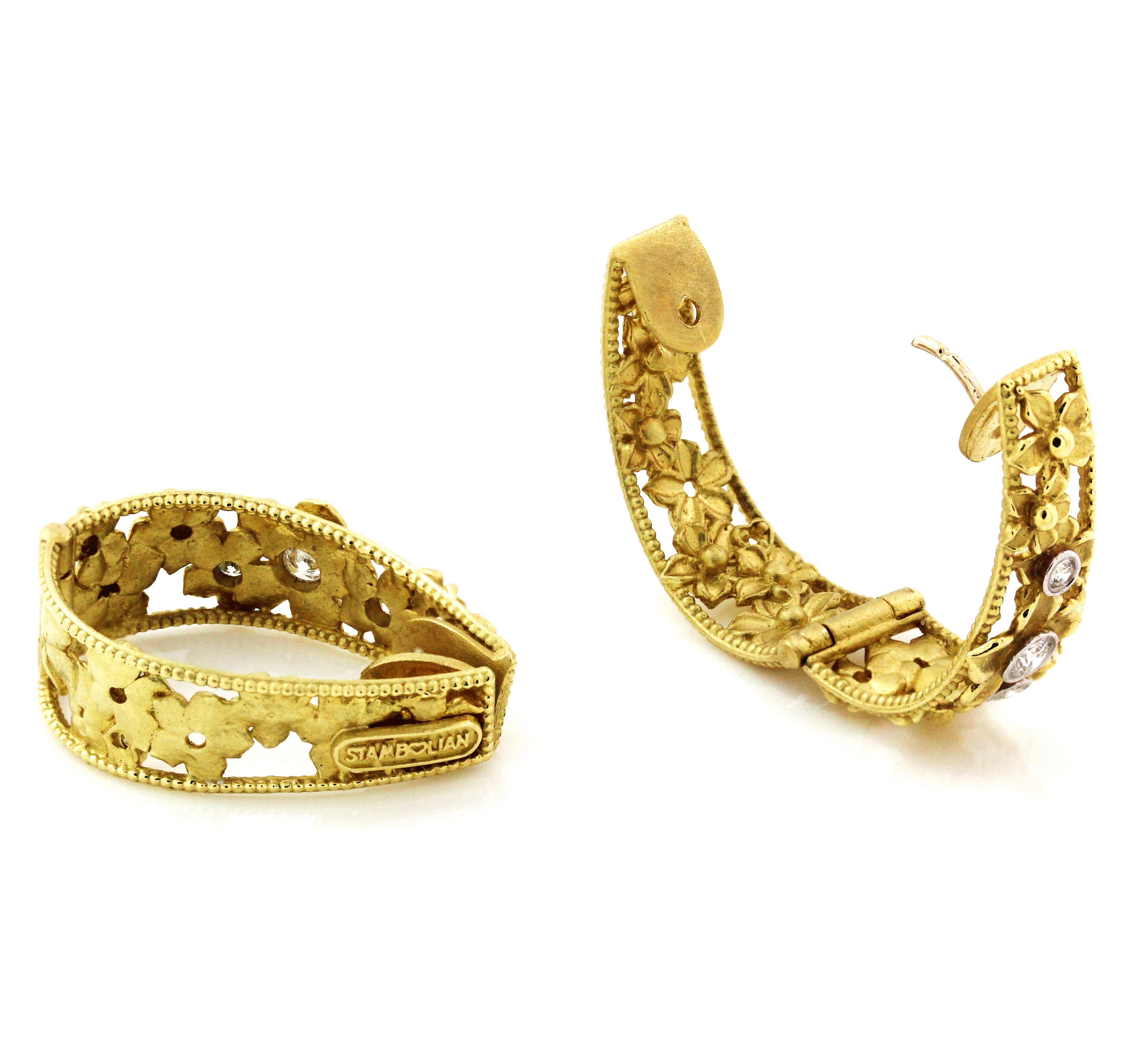 18K Yellow Gold and Diamond Floral Hoop Earrings by Stambolian

These are inside-out earrings with diamonds set on face of earrings and floral design continuing on the interior.

0.34ct. G color, VS clarity diamonds. 6 total stones.

Earrings are 1