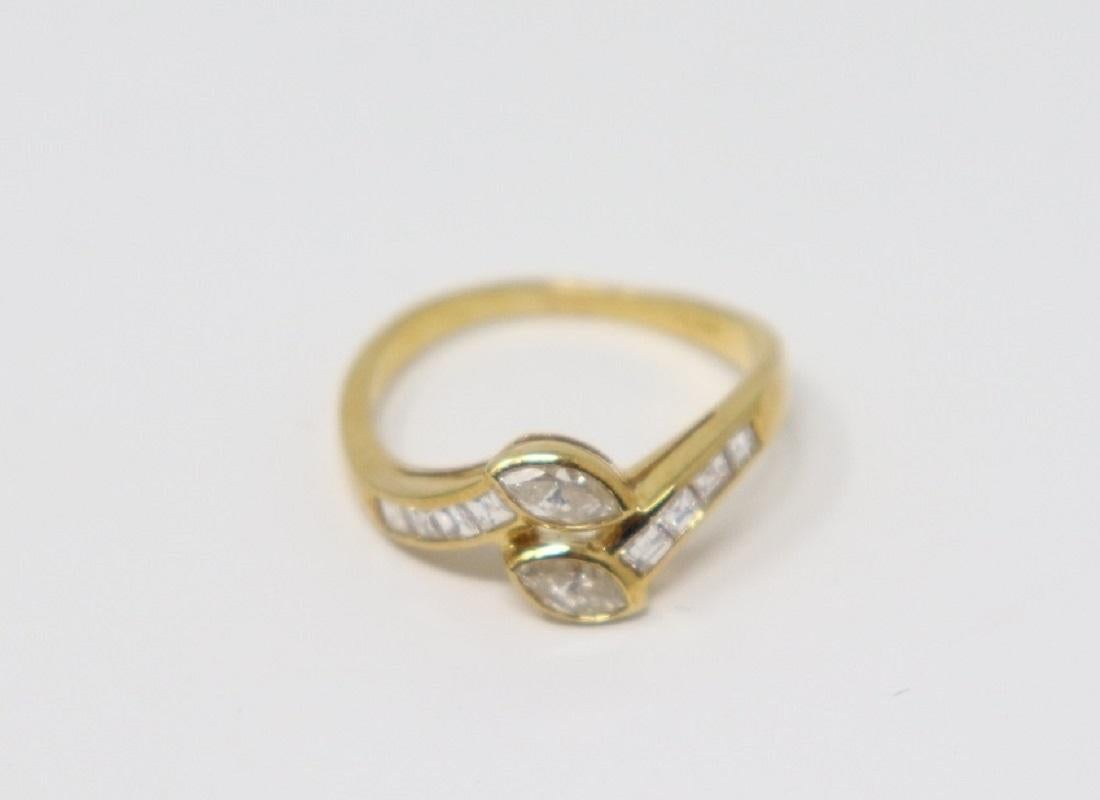 18 Karat yellow gold ring with navette cut diamonds about 0.37 Carats and carré cut diamonds total about 0.26 Carats. 
Total weight: 4.10 g.
New contemporary jewelry. Produced in the famous Italian city of gold Valenza. 
Ring size Italian 16 please