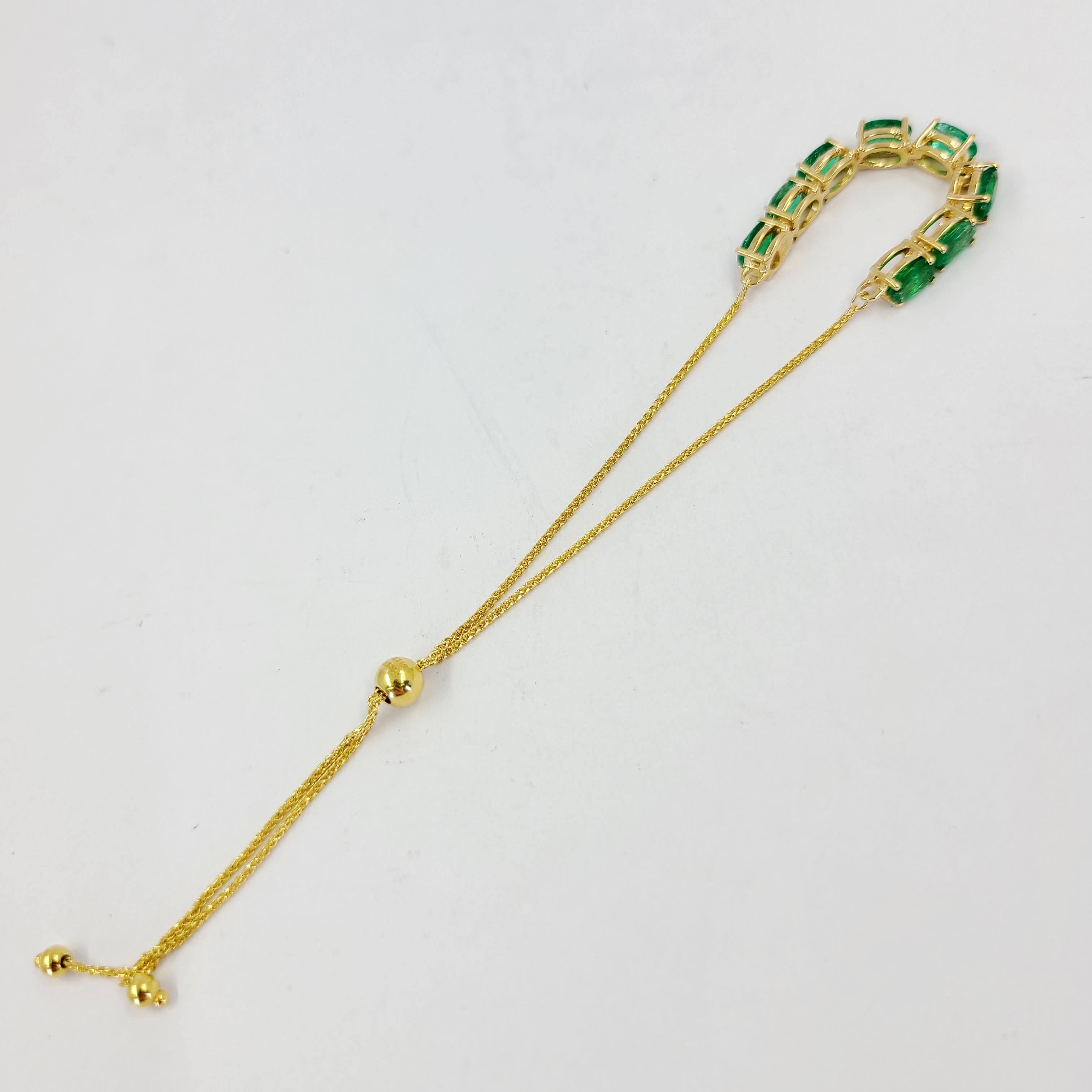 Oval Cut Yellow Gold and Emerald Bolo Bracelet For Sale