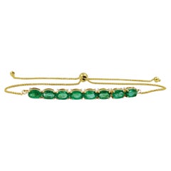 Bracelet Bolo en or jaune et émeraudes