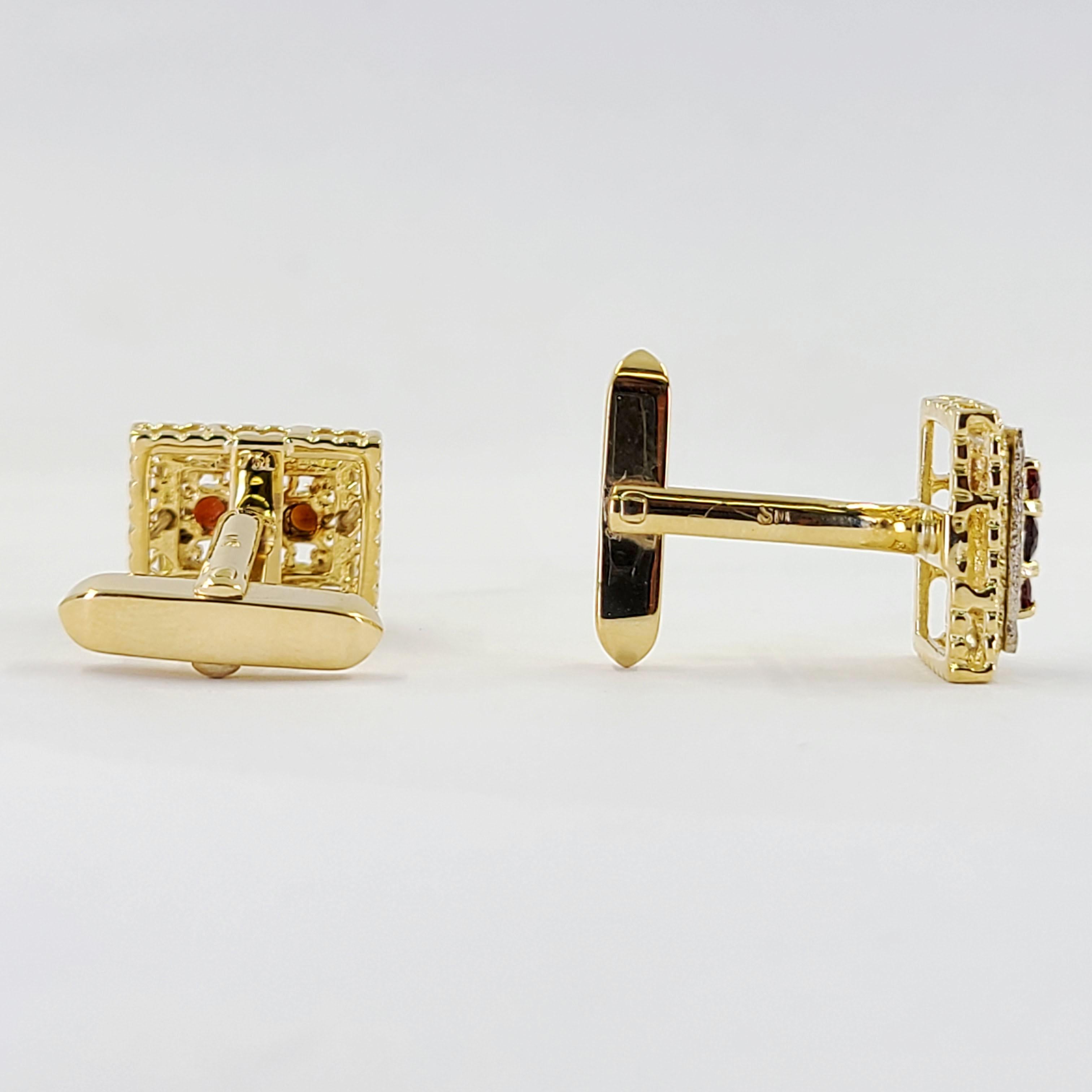 18 Karat Yellow Gold Cufflinks Featuring 6 Round Garnets Totaling 0.60 Carats Accented By A White Gold Pattern Border. Torpedo Style Backs. Finished Weight Is 12.0 Grams.