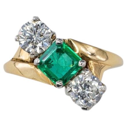 Yellow Gold and Platinum Square-Cut Emerald and Diamond Three-Stone Bypass Ring