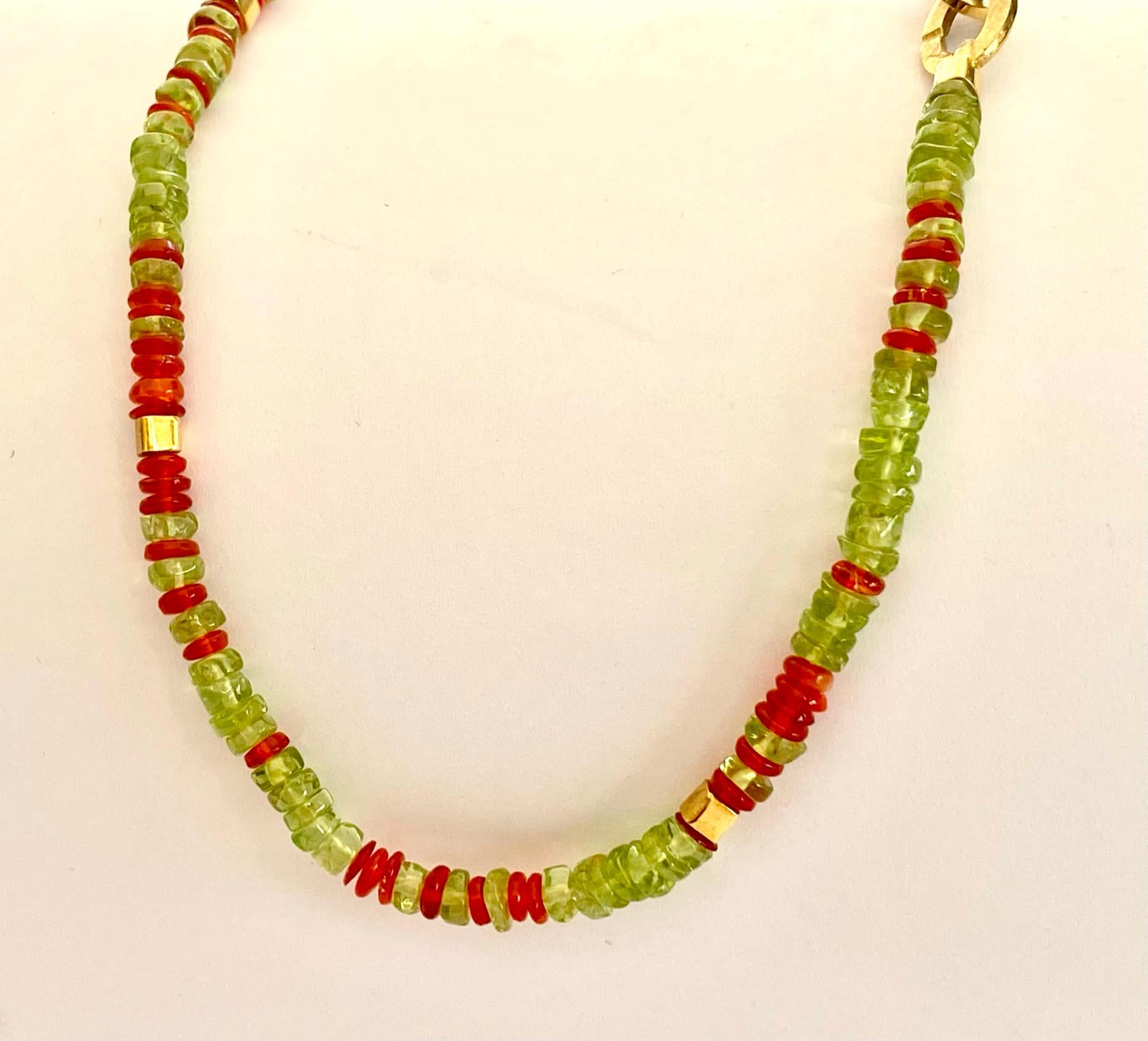 One (1) Colored Stone Necklace with 18 Karat Yellow Gold Lock and Cubic Beads.
This Necklace is set with Natural Peridots and Natural Fire Opals.
Hand made and one of a kind.  (Germany, Idar Oberstein 2015)
Special 18K. Yellow Gold Lock.
Lenghts: 44