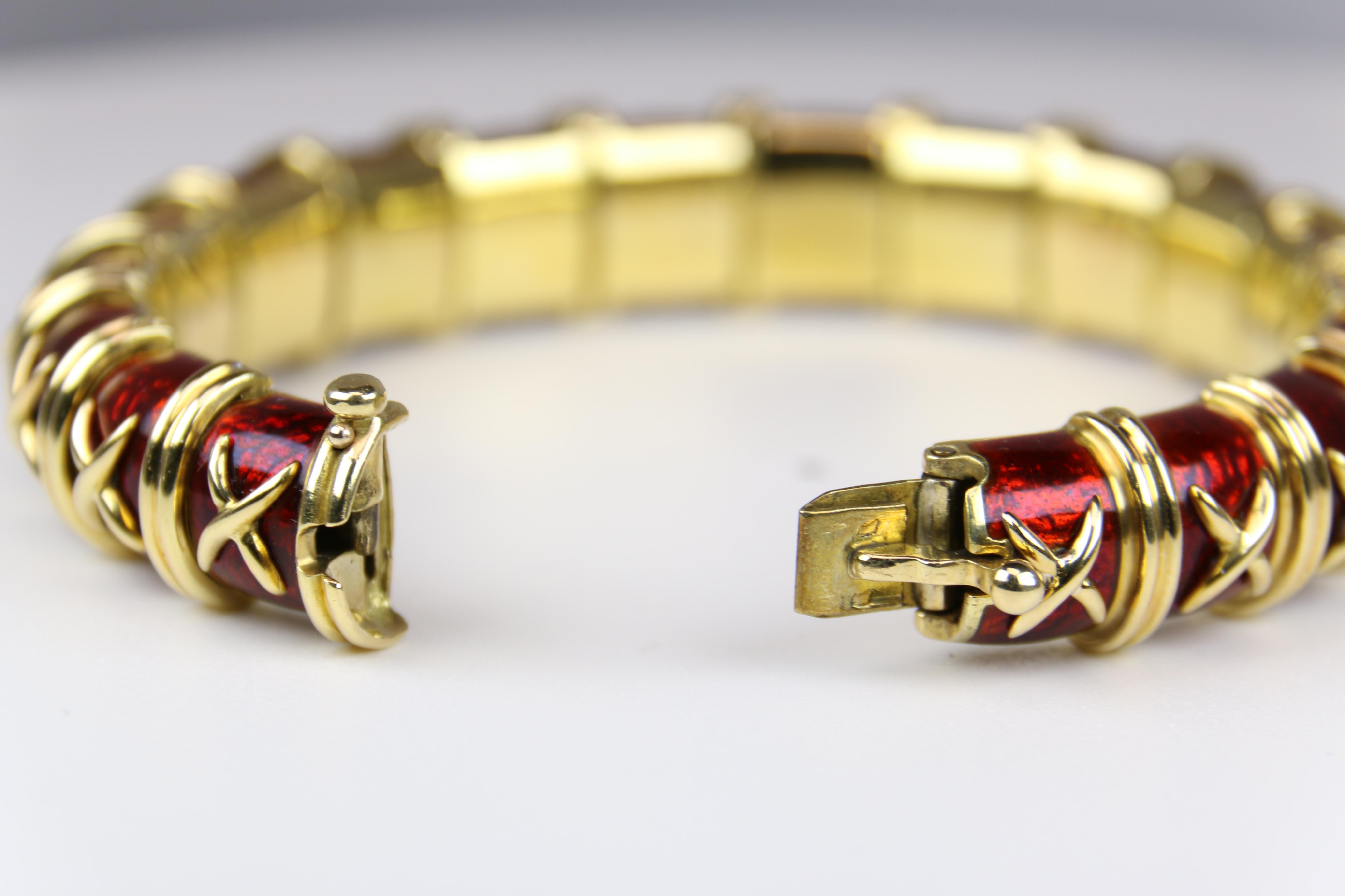  This gorgeous 18K Yellow gold Red Enamel Bracelet is a Classic in Schlumberger style. Sporting a Pin Safety Clasp in 18k yellow gold that is shadowed by classy and timeless red enamel, this piece is absolutely stunning.
