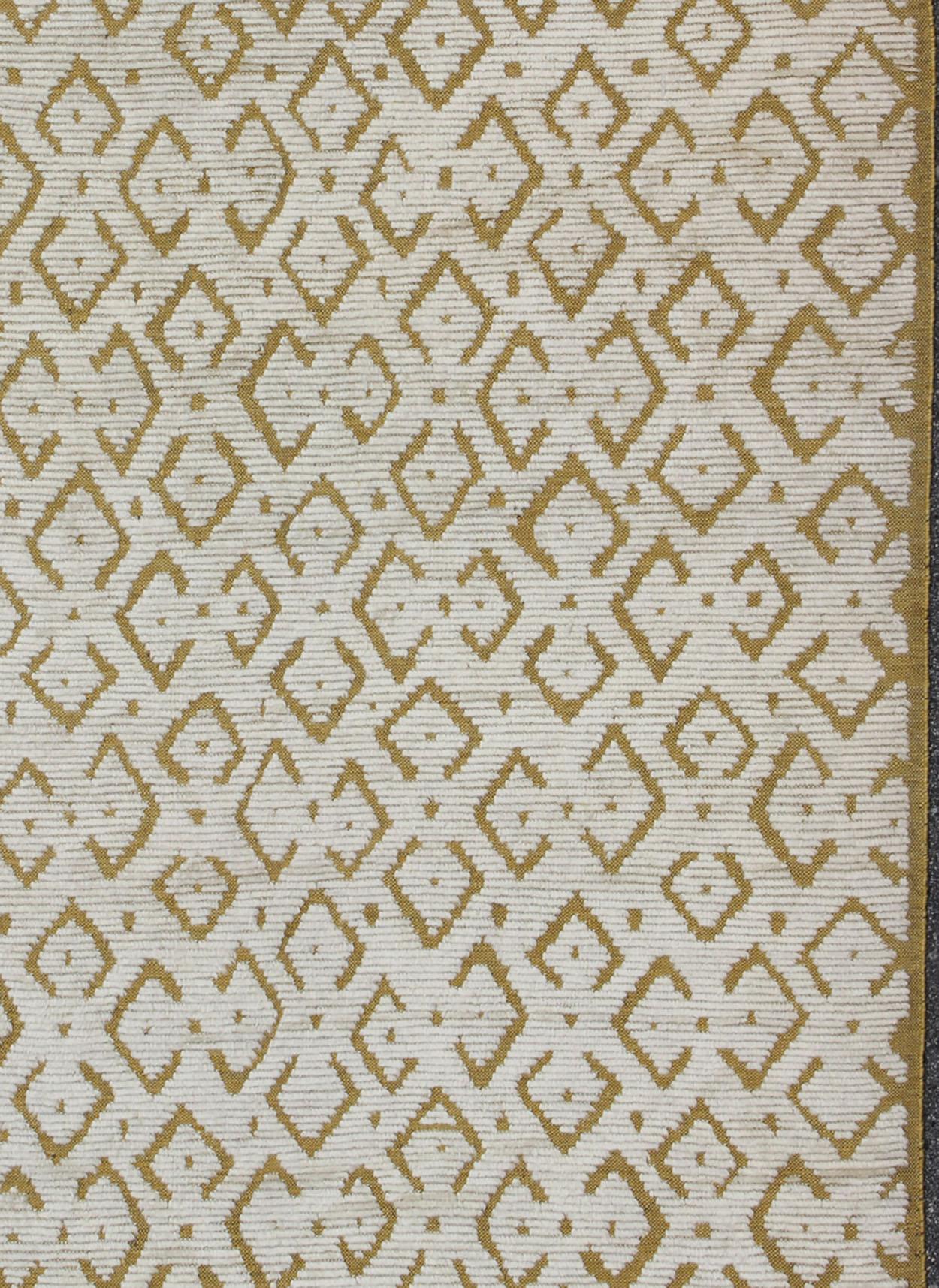 Keivan Woven Arts, OB-9263199-258032, Moroccan Design Rug- 10' × 14'. This hand-knotted Moroccan rug features a Modern design rendered in yellow/gold and white/ivory tones. 

Measures: 10'0 x 14'0.