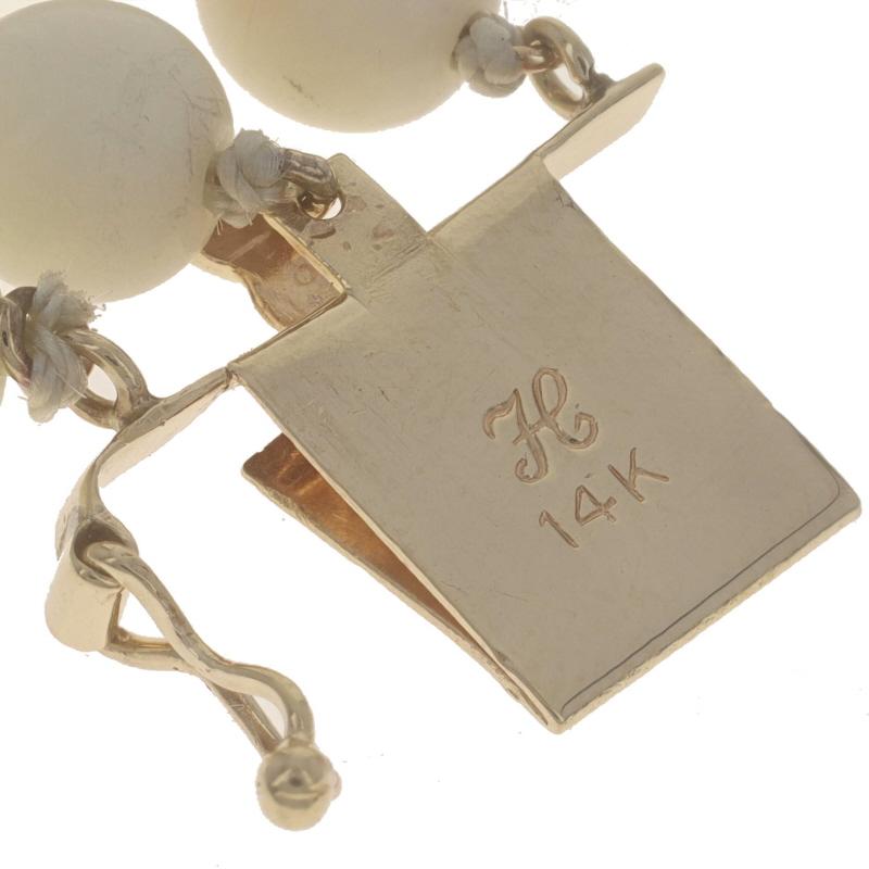 Bracelet vintage à trois rangs noués en or jaune et corail peau d'ange 7