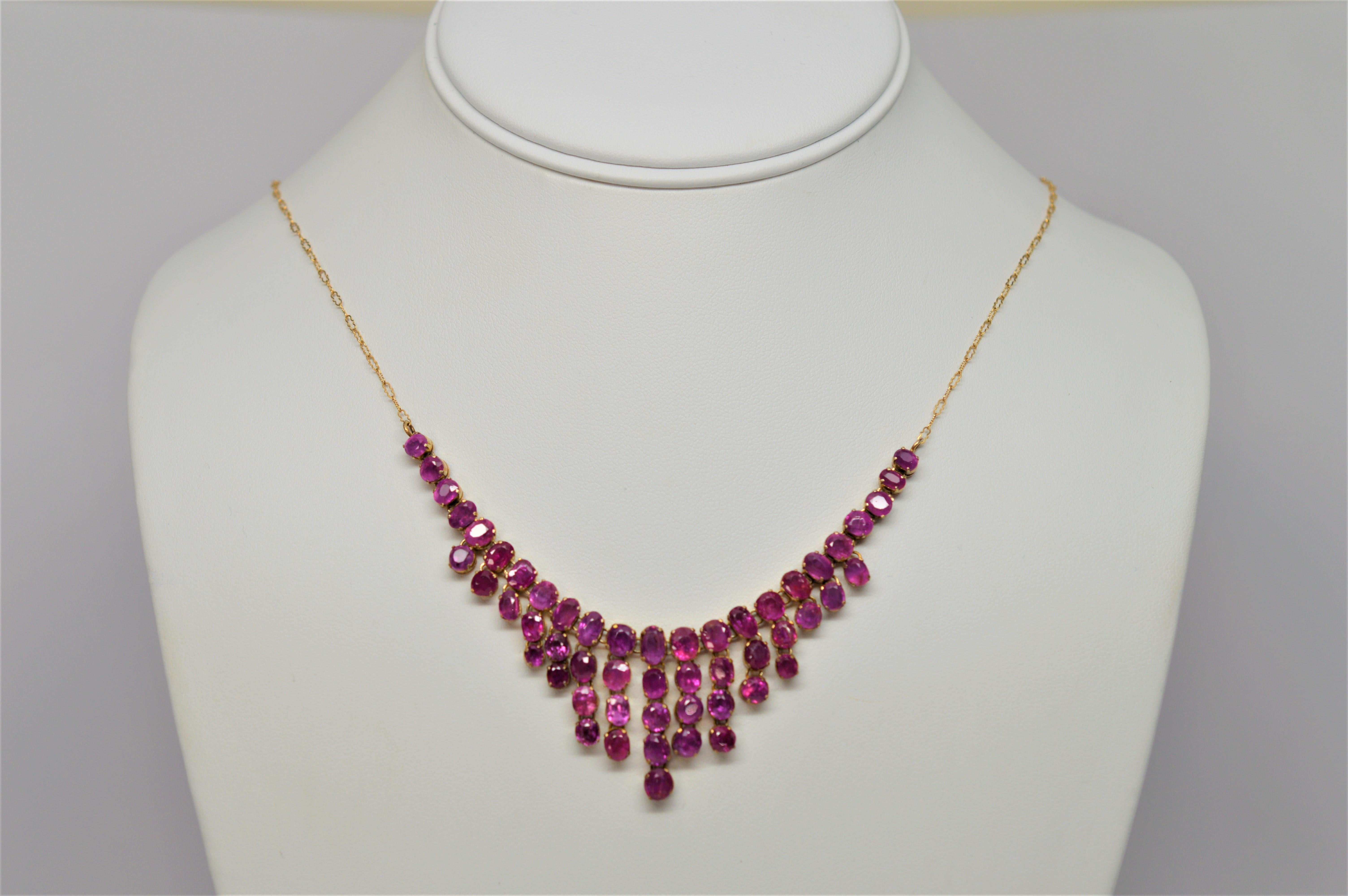 Dripping with gorgeous rose cut pink sapphires, this antique necklace evokes true femininity.  3-1/2 carats consisting of fifty three individually set potent pink sapphires in 10 karat yellow gold demonstrate warmth and compassion and span