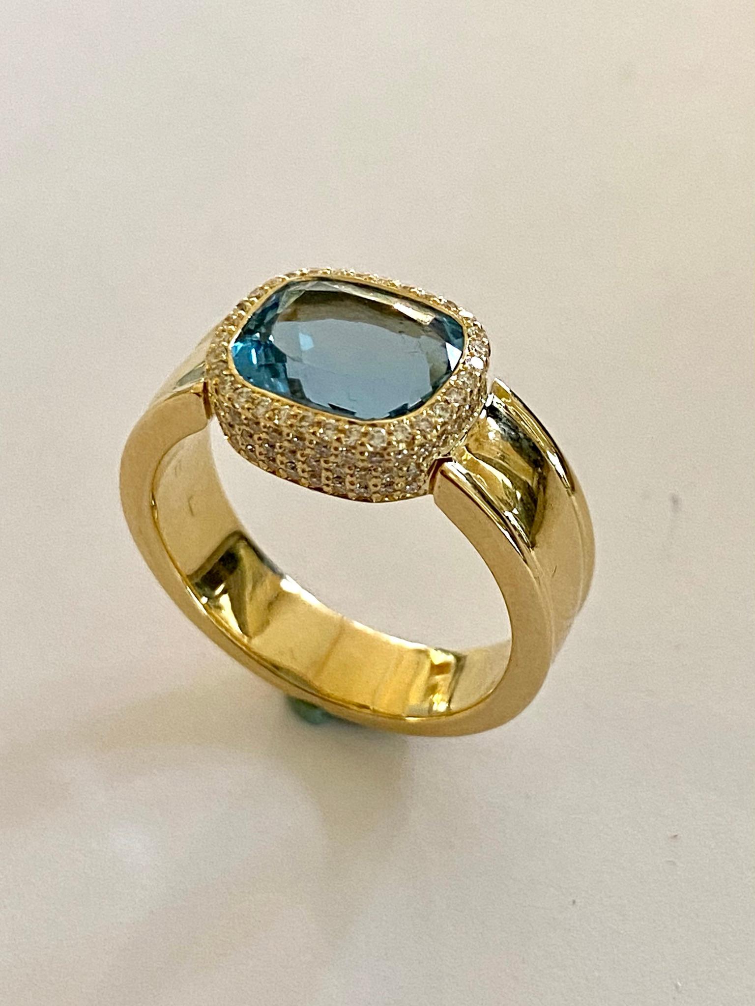 One (1) 14 Karat Yellow Gold Ring stamped 585 
Set with  one (1) Cushion mixed Cut Natural Aquamarine   weight: 3.65 ct.
and
106 Brillant Cut natural Diamonds:  weight: 0.47 ct VVS/VS  E-F
Weight: 10.43 grams
Size of the Ring:  17.5 (55)   USA: 7.25