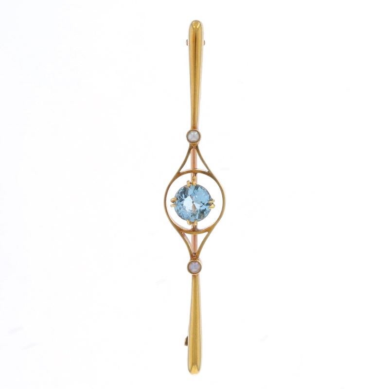 Era: Edwardian
Date: 1900s - 1910s

Metal Content: 15k Yellow Gold

Stone Information

Natural Aquamarine
Treatment: Heating
Carat(s): .75ct
Cut: Round
Color: Blue

Natural Pearls

Total Carats: .75ct

Style: Bar Brooch
Fastening Type: Hinged Pin