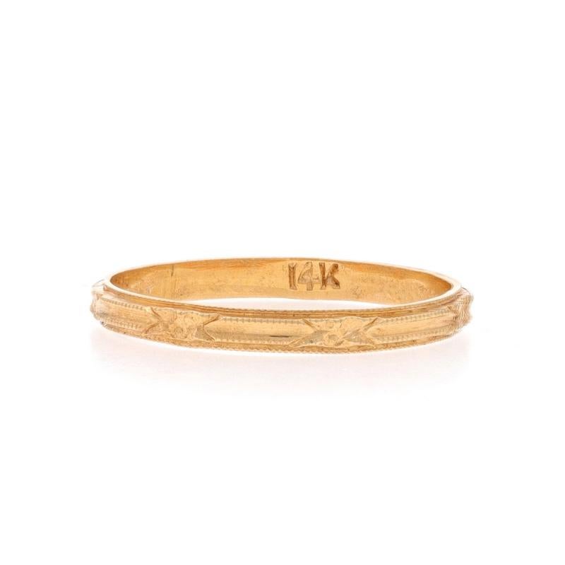 Size: 5 1/2

Era: Art Deco
Date: 1920s - 1930s

Metal Content: 14k Yellow Gold

Style: Wedding Band without Stones
Theme: Flowers
Features: Etched Floral & Milgrain Detailing Spanning the Entire Perimeter

Measurements

Face Height (north to south):