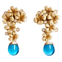 Boucles d'oreilles fleurs en or jaune avec diamants et topaze