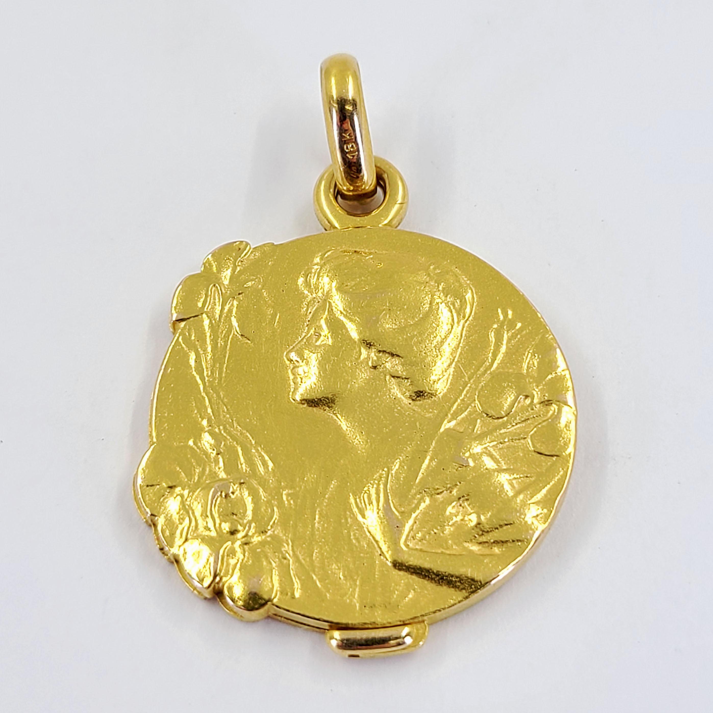 18 Karat Yellow Gold Art Nouveau Locket Featuring A Woman's Profile and Matte Finish. Engraved Back. 1 Inch Diameter. Finished Weight Is 12.3 Grams.