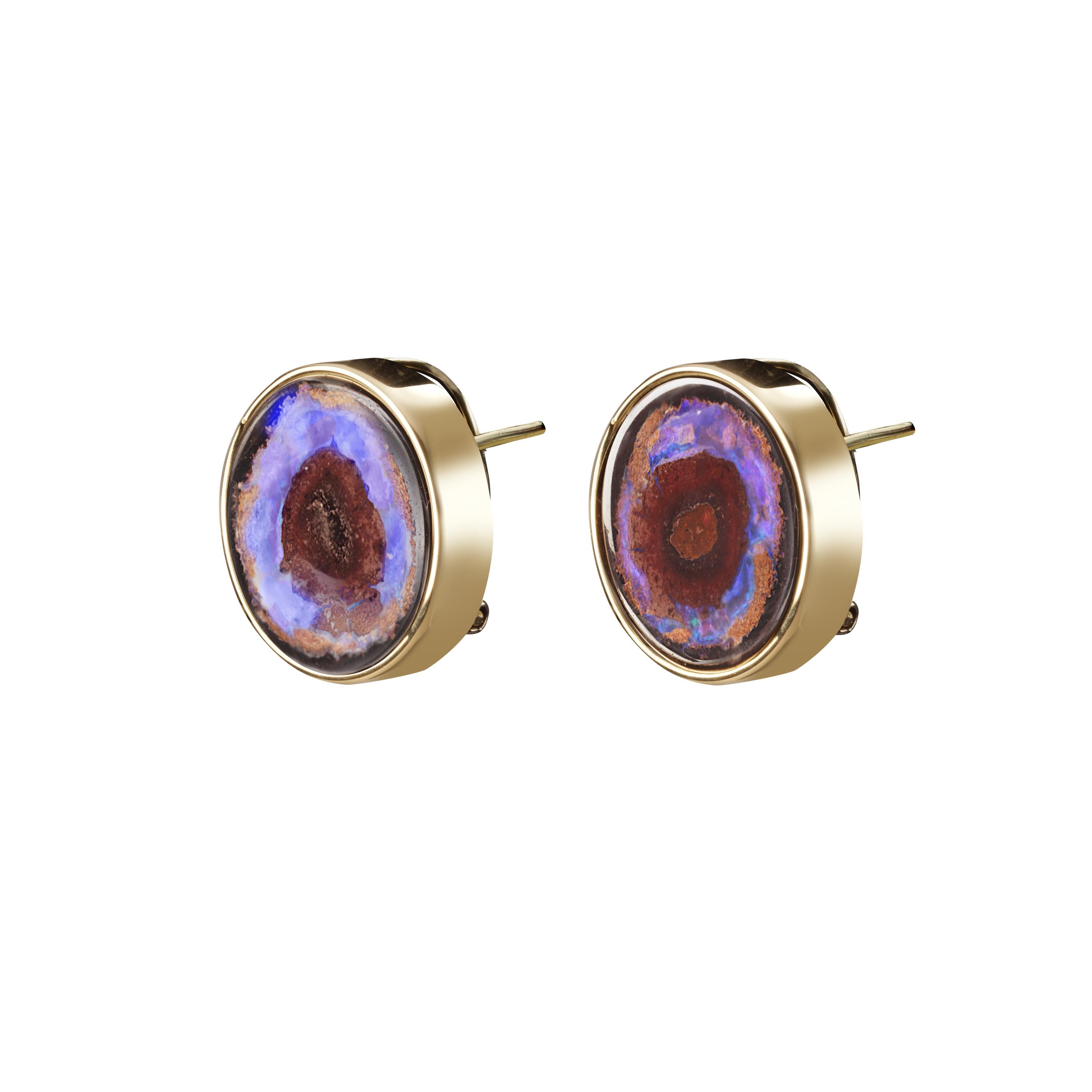 These stud earrings are handmade in 18k yellow gold with two unusual Australian boulder opals.
These two opals, a fantastic  pair, have a natural combination of  brown, blue and purple hues.
The earrings close with an omega clasp.
They are a unique