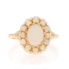 Anello aureola in oro giallo australiano 10k con cabochon ovale e cabochon rotondo 1,14ctw