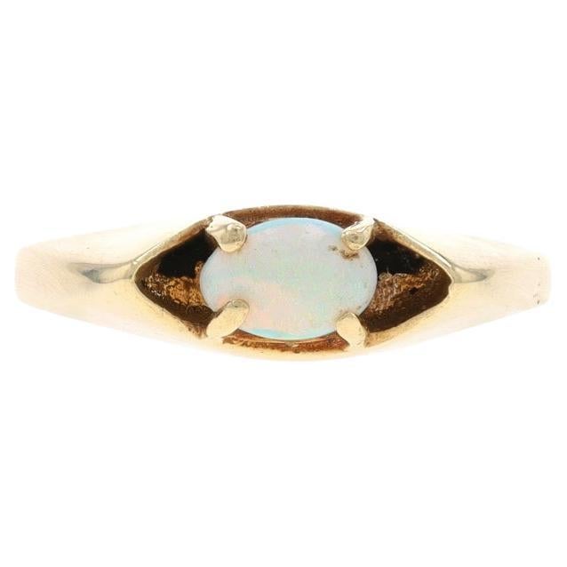 Anello solitario di opale australiano in oro giallo 10k con cabochon ovale .28ct
