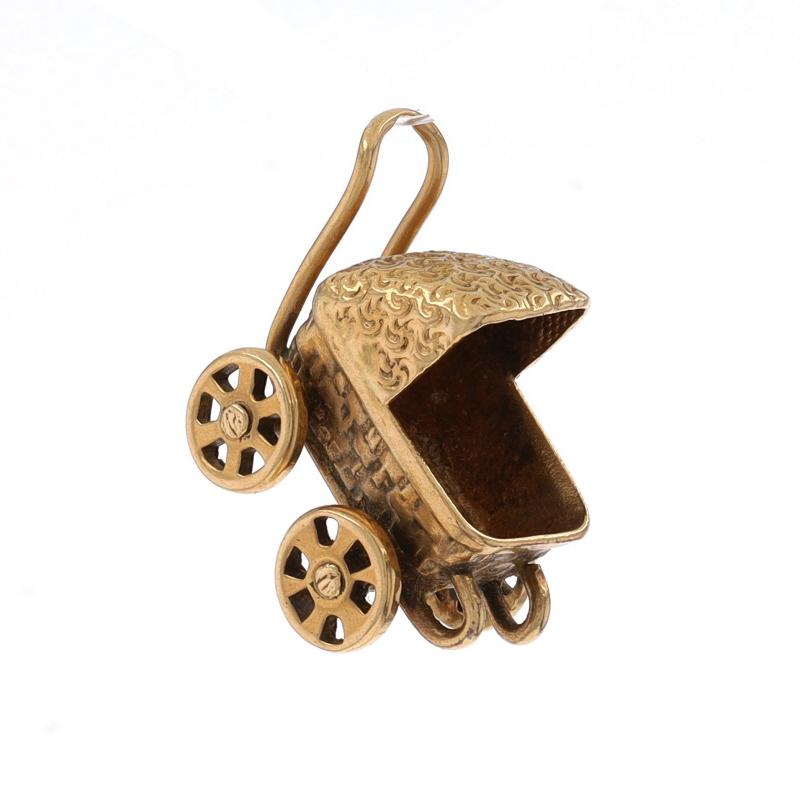 Metal Content: 14k Yellow Gold

Theme: Baby Carriage, Infant Pram Stroller
Features: Wheels Move

Measurements
Tall (from stationary bails): 11/16