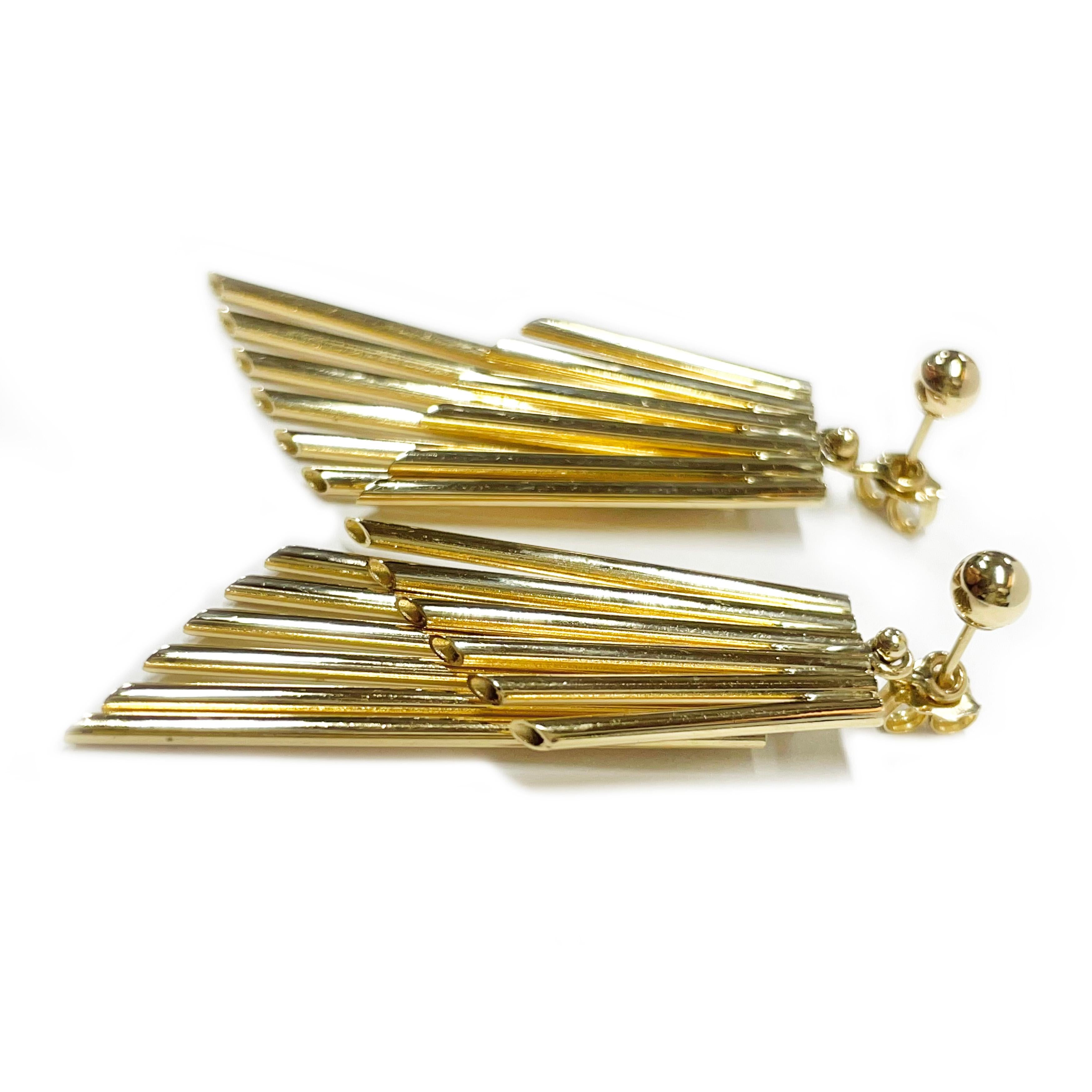 14 Karat Yellow Gold Ball Studs Jacket Earrings. These earrings can be worn as just 4mm ball studs or with the double layer of musical pipes/tube jackets. Each portion contains six hollow tubes resembling musical pipes. The earrings measure 1.78