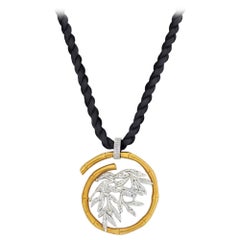 Yellow Gold Bamboo Tree Motif on a Silk Cord Pendant