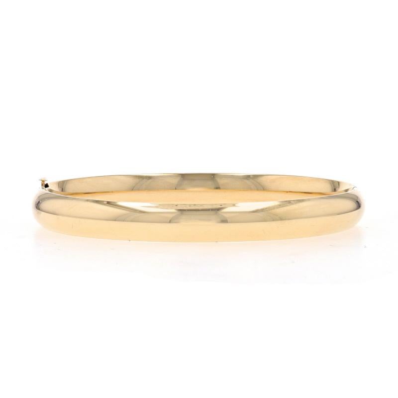 Metal Content: 14k Yellow Gold

Style: Bangle
Fastening Type: Slide Clasp
Features: Hollow construction for comfortable, all-day wear

Measurements
Inner Circumference: 7 1/4
