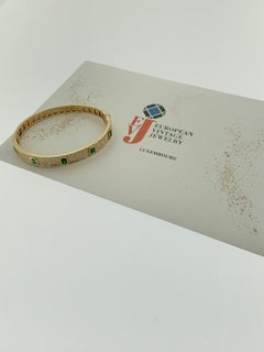 Yellow Gold Bangle Bracelet with Diamonds and Emeralds