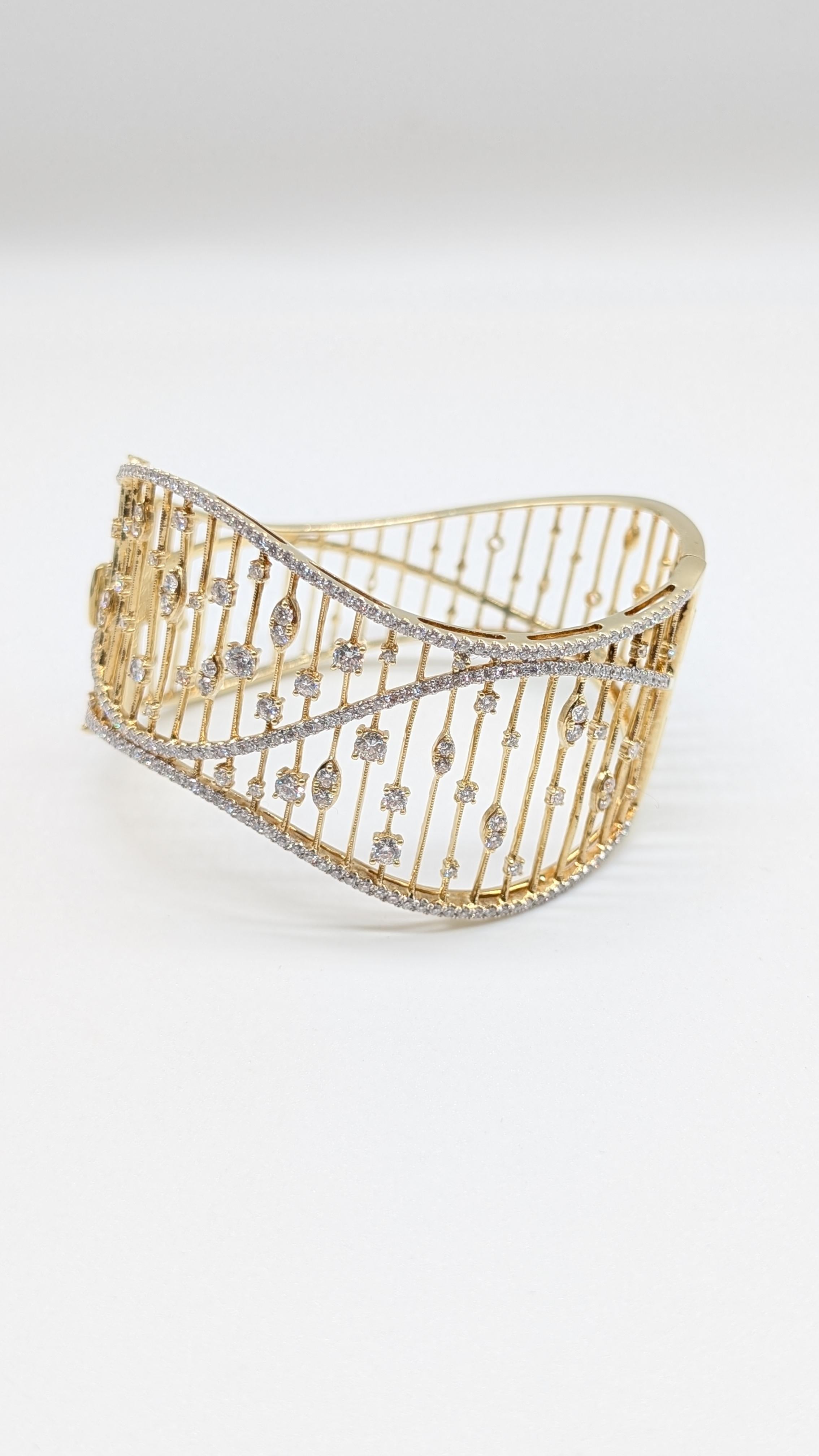 Elegant 14K Gold Bangle Cuff Bracelet with 3.57 Carats of Round Brilliant-Cut Diamonds

A timeless statement of sophistication and modern elegance, this exquisite bangle cuff bracelet is finely crafted in radiant 14K gold and adorned with dazzling