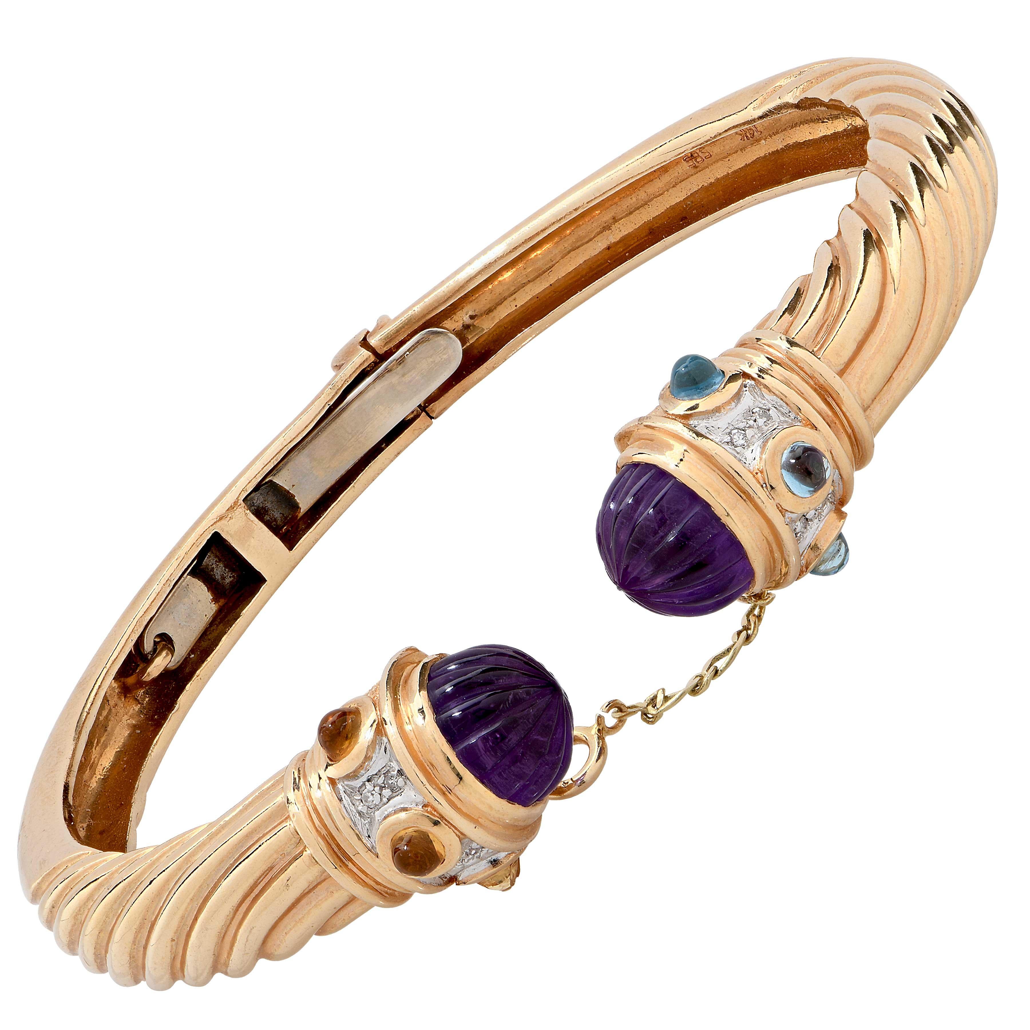 Yellow Gold Bangle with Amethyst Accents in 14 Karat Yellow Gold.
Metal Type: 14 Karat Yellow Gold.
Metal Weight: 29.26 Grams