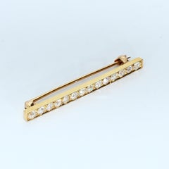 Yellow Gold Bar Brooch with 12 White Diamonds SI2/E