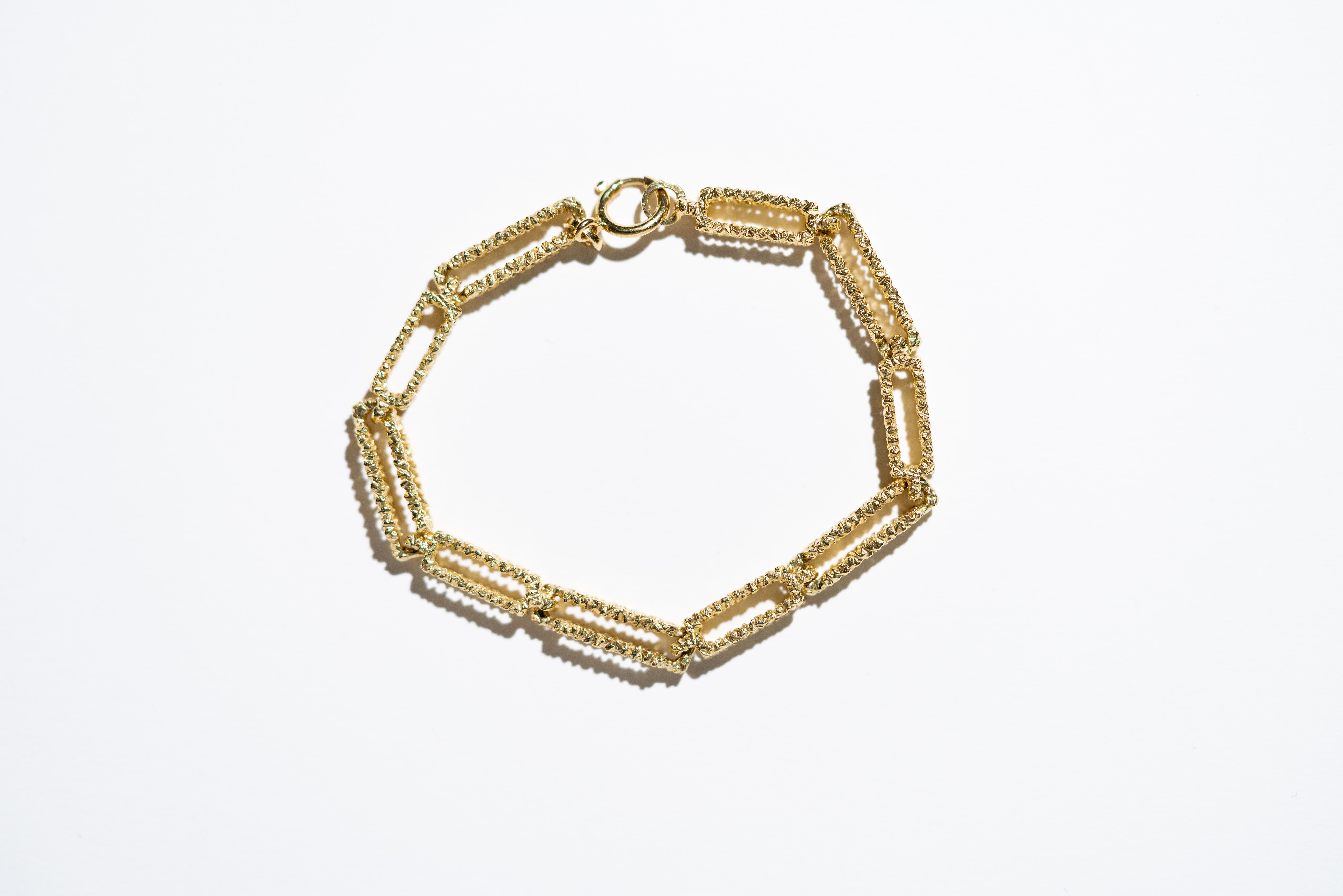 Beautifully textured bark effect 18 carat yellow gold link bracelet with 3D rectangular links. Crafted in Europe and purchased in Ireland in the 1970's, this bracelet is in pristine condition and looks as new. A glinting treasure of a jewel.

Length