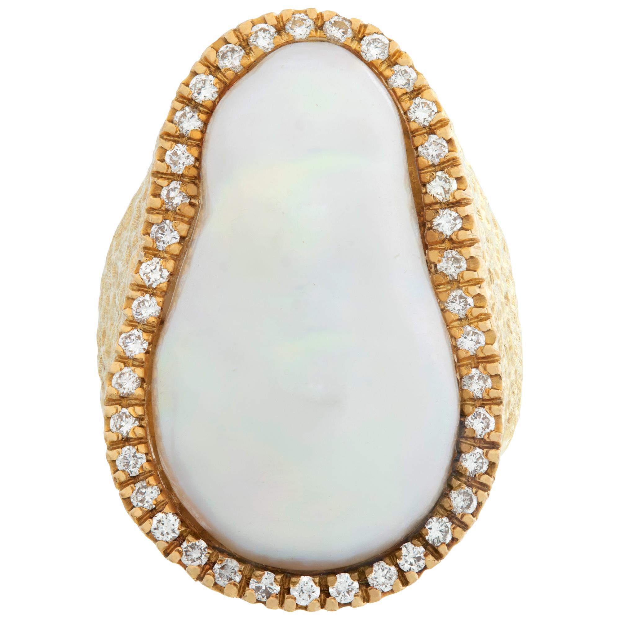 Baroque Mabe pearl (over 18mm)  & diamonds ring in 18K yellow gold. Round brilliant cut diamonds total approx. weight: 0.57 carat, estimate: G-H color, VS clarity. Size 6.This Pearl/diamond ring is currently size 6 and some items can be sized up or