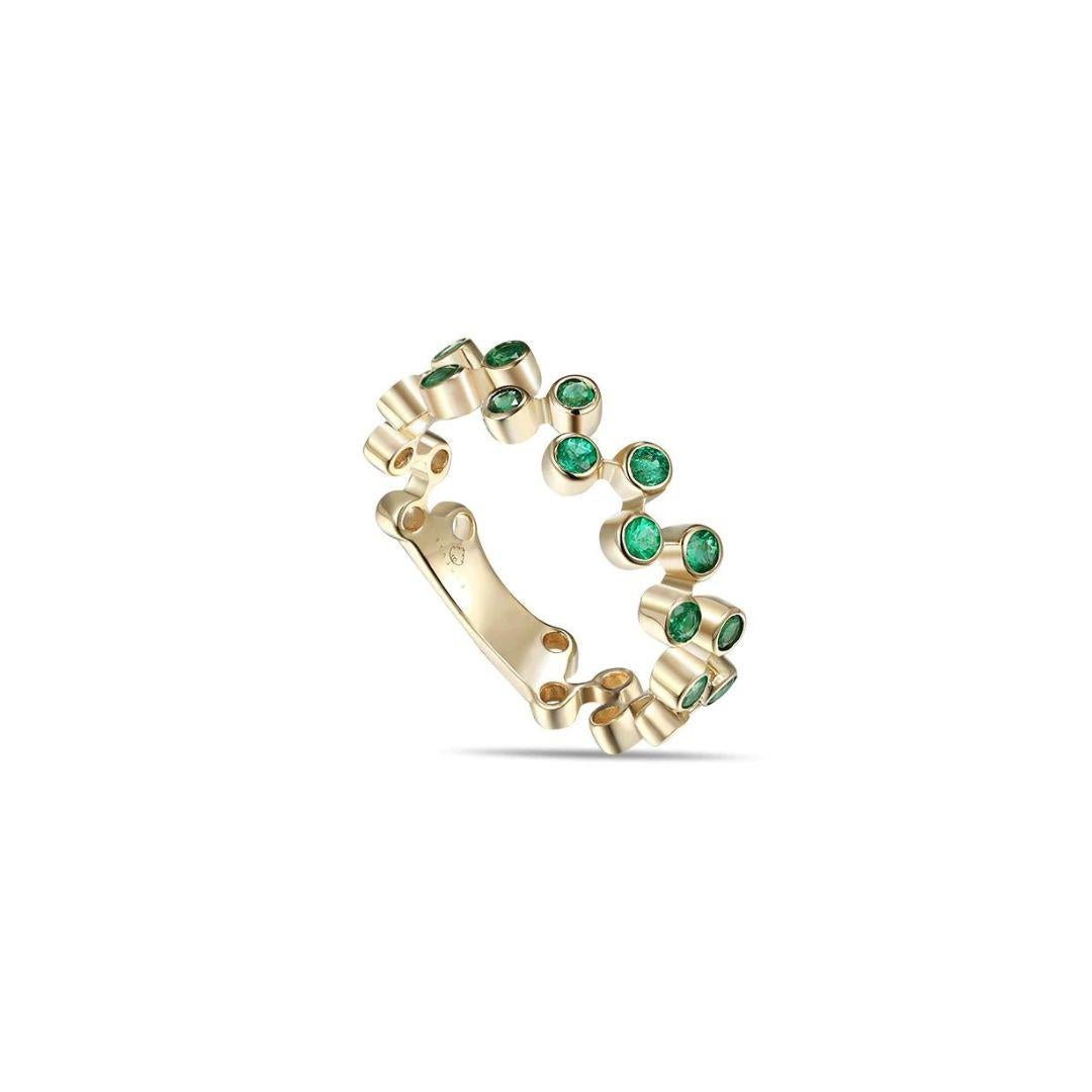 
Yellow gold emerald fashion band with open space design. Use this ring as a stackable band to combine or complement other rings, as a one of a kind wedding band, anniversary gift, birthday gift for May or any other special occasion. Band contains