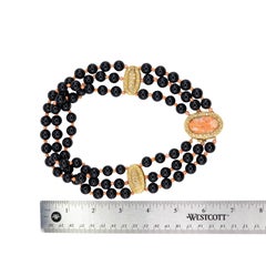 Yellow Gold, Black Onyx, Coral Cameo, and Diamond Three-Strand Statement Necklac