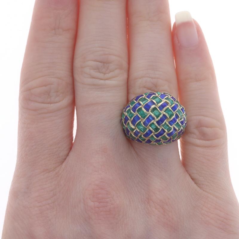 Size: 6 1/4
Sizing Fee: Up 1 size for $60 or Down 1/2 a size for $40

Metal Content: 14k Yellow Gold

Material Information
Enamel
Color: Blue & Green

Style: Dome
Theme: Basketweave

Measurements
Face Height (north to south): 23/32