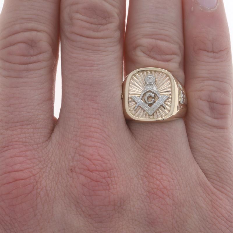 Size: 10 1/4
Sizing Fee: Up 3 sizes for $50 or Down 2 sizes for $40

Organization: Blue Lodge

Metal Content: 10k Yellow Gold & 10k White Gold

Features: Smoothly finished with etched & textured detailing

Measurements

Face Height (north to south):