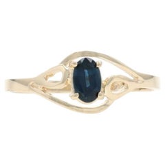 Yellow Gold Blue Sapphire Solitaire Bypass Ring - 10k Oval .26ct