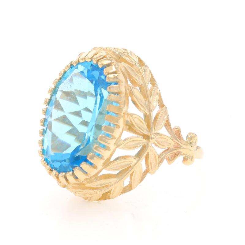 Yellow Gold Blue Topaz Cocktail Solitaire Ring - 14k Oval 13.57ct Leaf Garland In Excellent Condition For Sale In Greensboro, NC