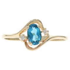 Yellow Gold Blue Topaz Diamond Bypass Ring - 10k Oval .62ctw