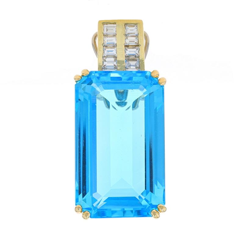 Metal Content: 18k Yellow Gold

Stone Information
Natural Blue Topaz
Treatment: Routinely Enhanced
Carat(s): 33.80ct
Cut: Emerald

Natural Diamonds
Carat(s): 1.00ctw
Cut: Baguette
Color: G - H
Clarity: VS1 - VS2

Total Carats: 34.80ctw

Style: