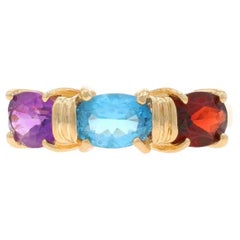 Yellow Gold Blue Topaz, Garnet, & Amethyst Three-Stone Ring - 10k Oval 2.95ctw