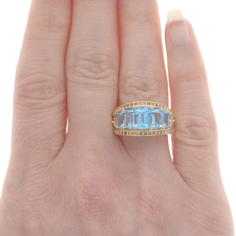 Yellow Gold Blue Topaz Graduated Five-Stone Ring 10k Emerald Cut 3.04ctw Size 9 In Excellent Condition In Greensboro, NC