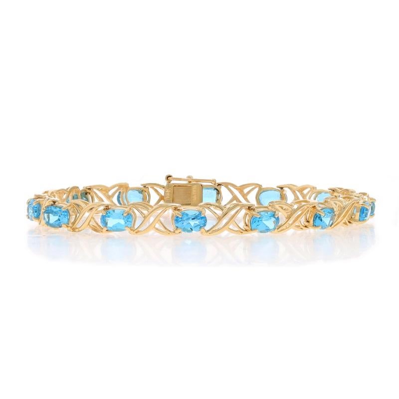 Metal Content: 14k Yellow Gold

Stone Information

Natural Topaz
Treatment: Routinely Enhanced
Carat(s): 7.98ctw
Cut: Oval
Color: Blue

Total Carats: 7.98ctw

Style: Link
Fastening Type: Tab Box Clasp with One Side Safety Clasp
Theme: