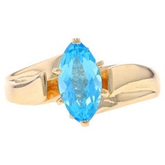 Yellow Gold Blue Topaz Solitaire Bypass Ring - 10k Marquise 1.20ct