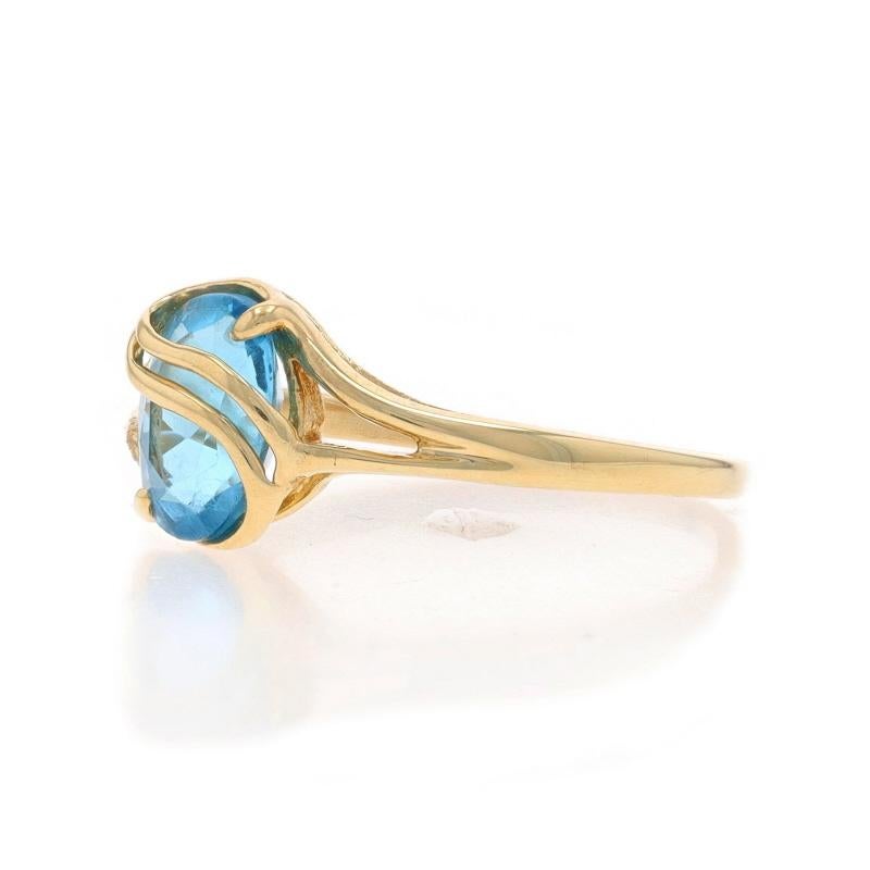 Yellow Gold Blue Topaz Solitaire Bypass Ring - 10k Oval 1.60ct In Excellent Condition In Greensboro, NC