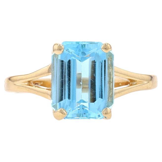 Bague solitaire en or jaune avec topaze bleue taille émeraude 14 carats, 3,75 carats en vente