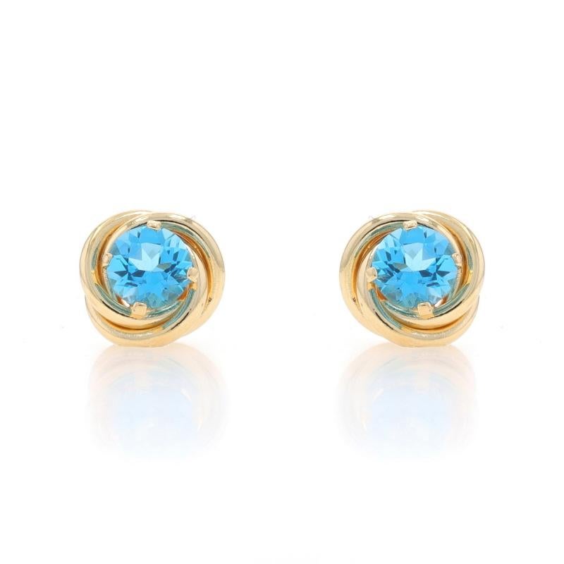 Metal Content: 14k Yellow Gold

Stone Information

Natural Blue Topaz
Treatment: Routinely Enhanced
Carat(s): 1.12ctw
Cut: Round

Total Carats: 1.12ctw

Style: Stud
Fastening Type: Butterfly Closures
Theme: Knot Twist

Measurements

Tall: 11/32