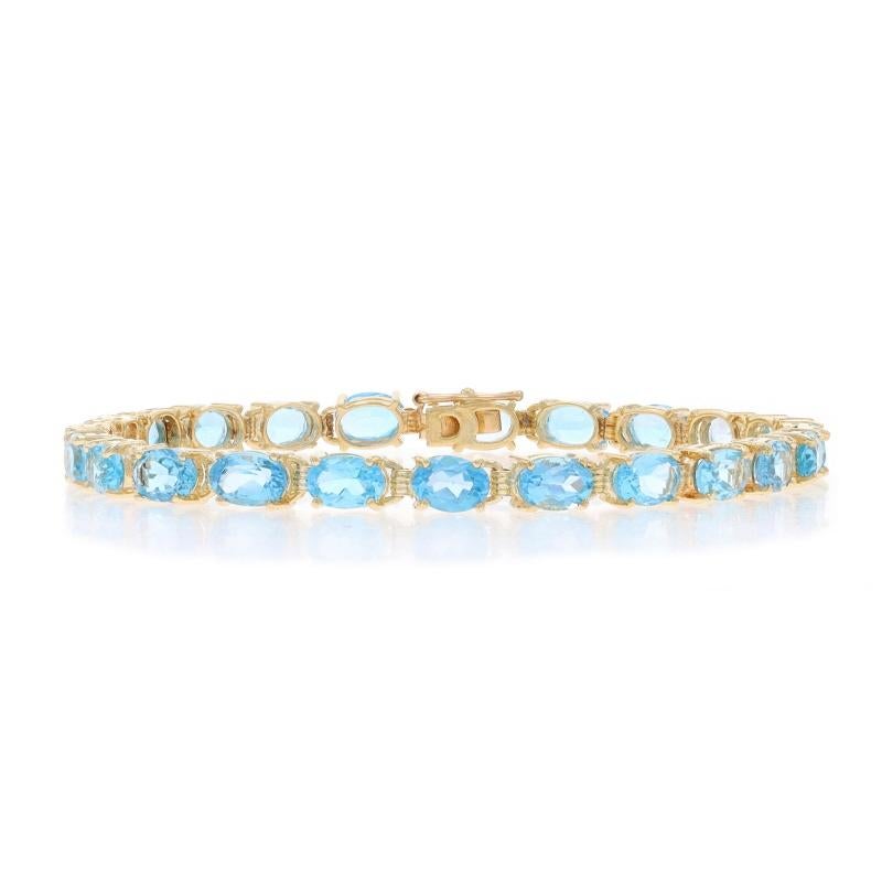 Metal Content: 10k Yellow Gold

Stone Information

Natural Topaz
Treatment: Routinely Enhanced
Carat(s): 13.11ctw
Cut: Oval
Color: Blue

Total Carats: 13.11ctw

Style: Tennis
Fastening Type: Tab Box Clasp with One Side Safety