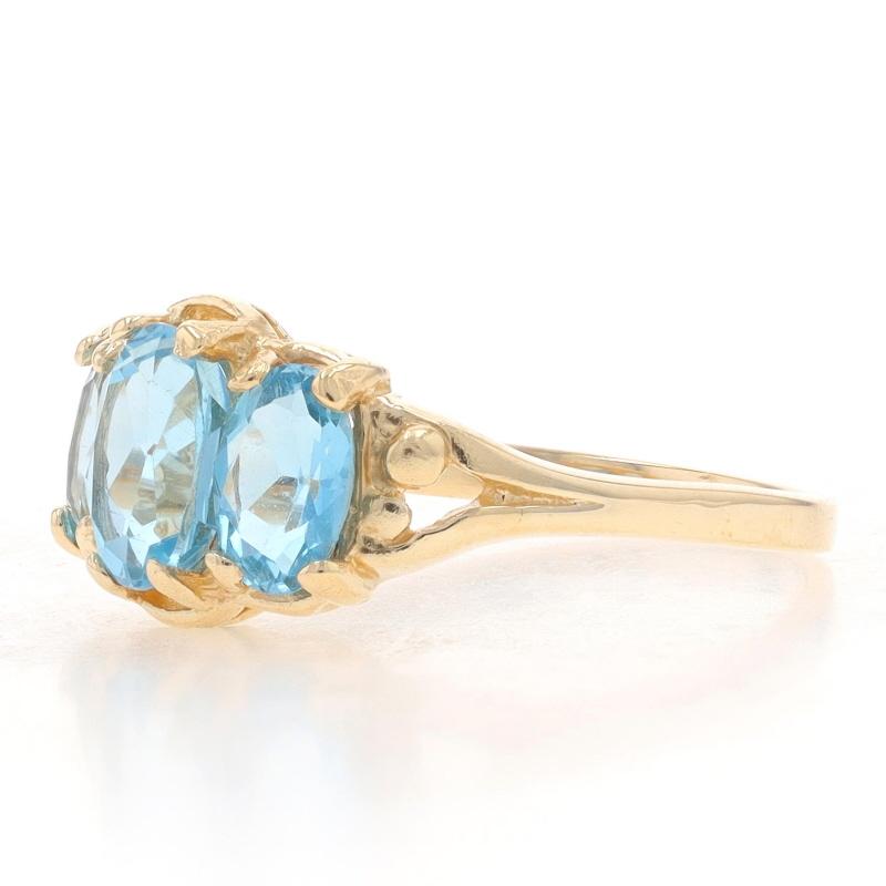 Oval Cut Yellow Gold Blue Topaz Three-Stone Ring - 10k Oval 1.95ctw For Sale