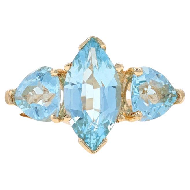 Yellow Gold Blue Topaz Three-Stone Ring - 14k Marquise & Trillion 3.24ctw For Sale